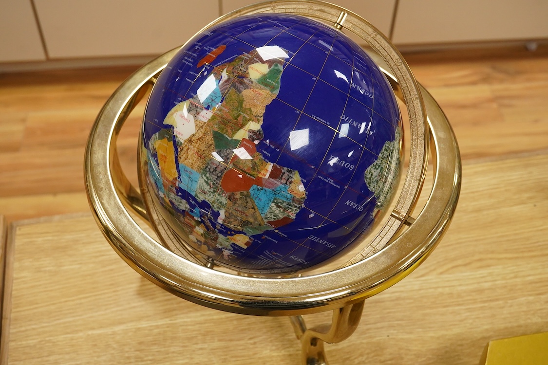 A simulated multi-mineral globe with compass, 30cm in diameter